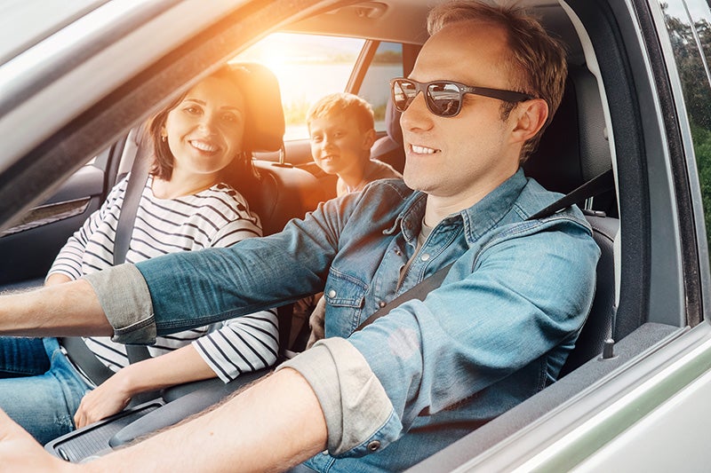 man and his family in the car